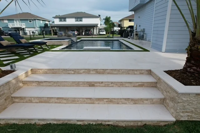 Travertine steps leading to pool deck